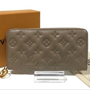 Authentic Louis Vuitton Coussin Monogram  Embossed Lambskin Leather Zippy Wallet